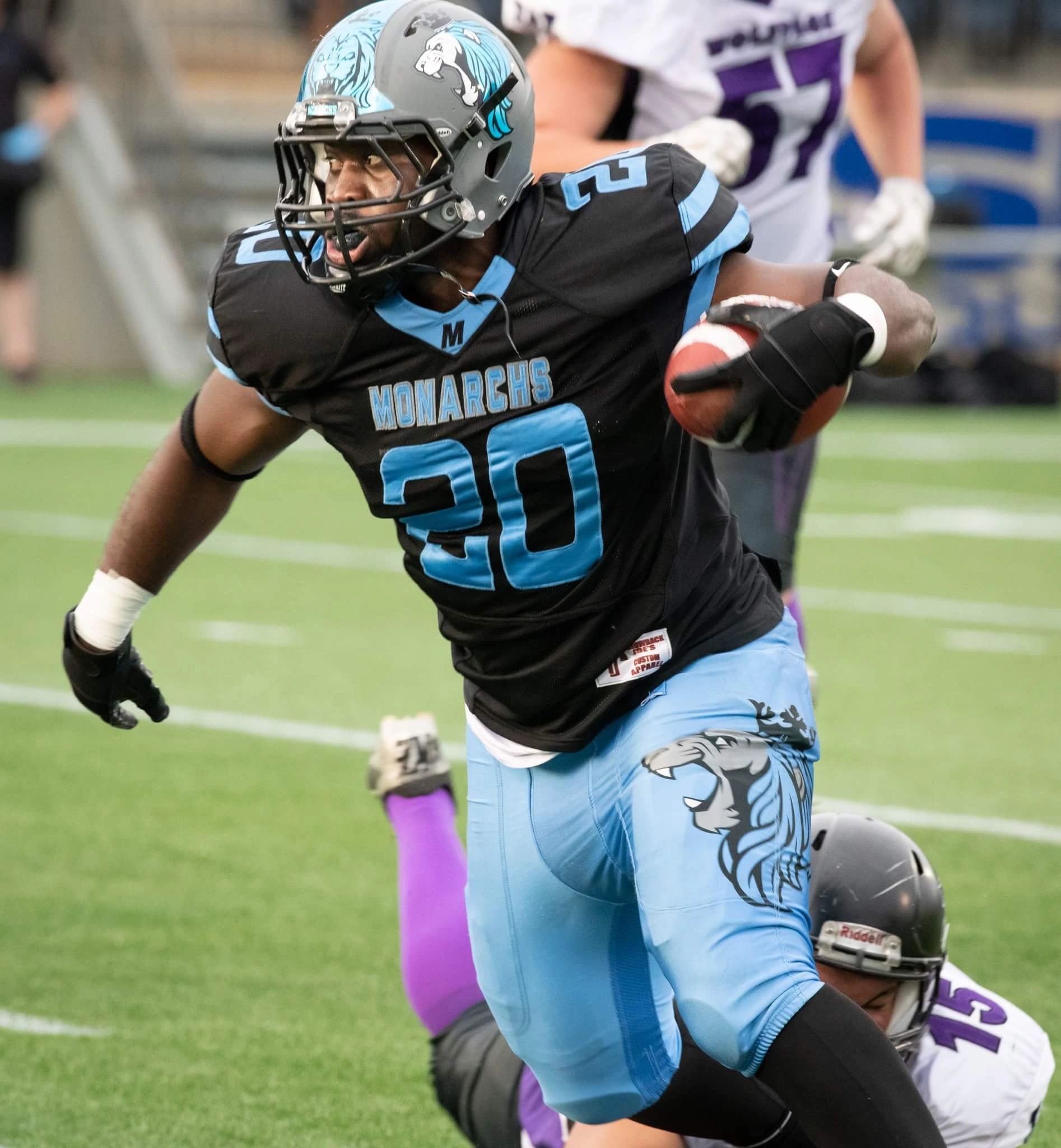 Monarchs ball carrier running through the defence