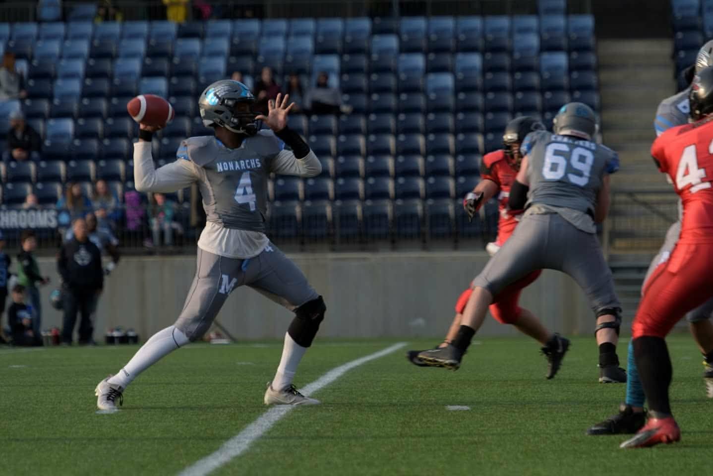 Monarchs quarterback throwing a pass at SMS Equipment Stadium