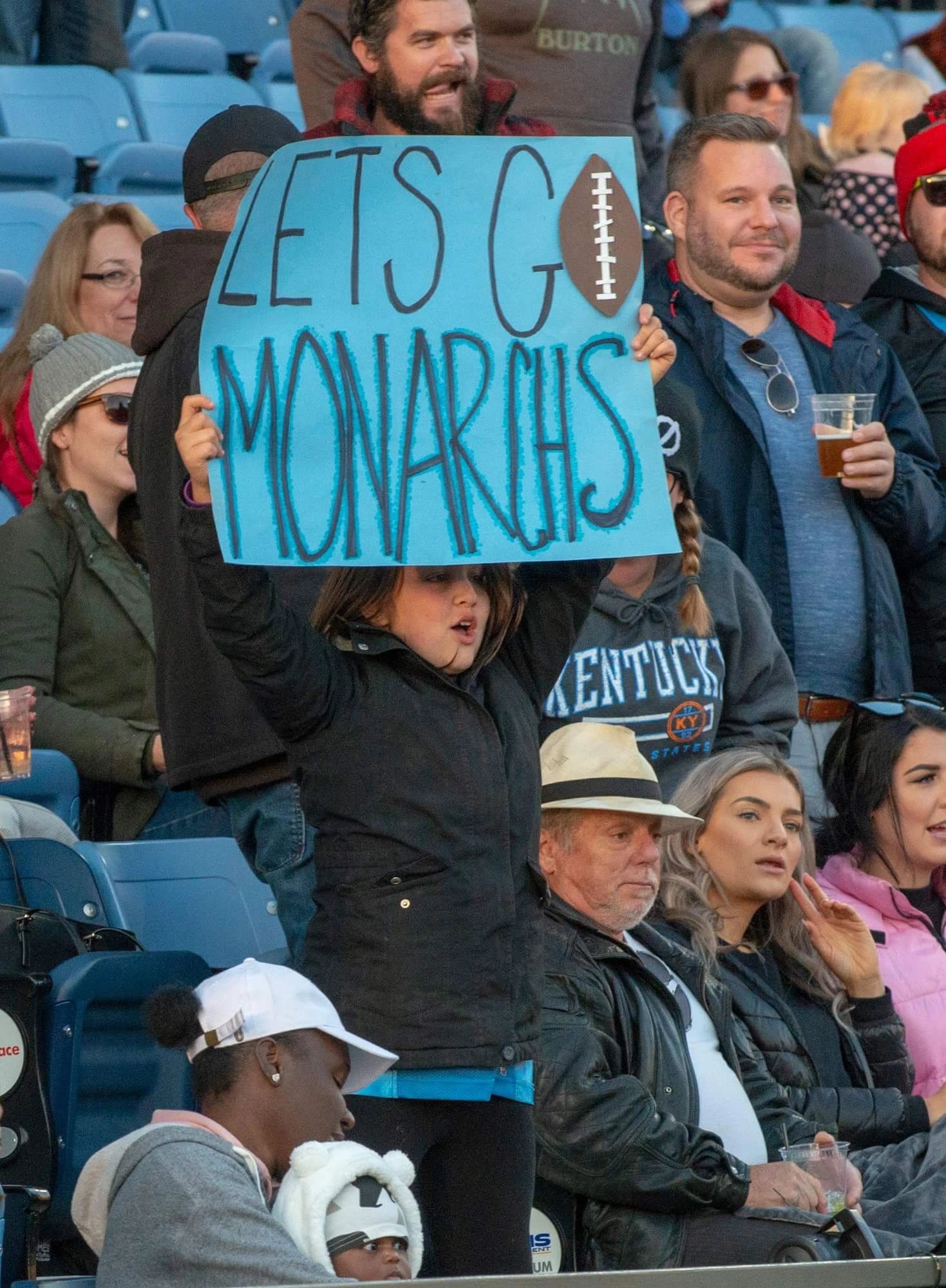 Monarchs fans holding a Let's Go Monarchs sign